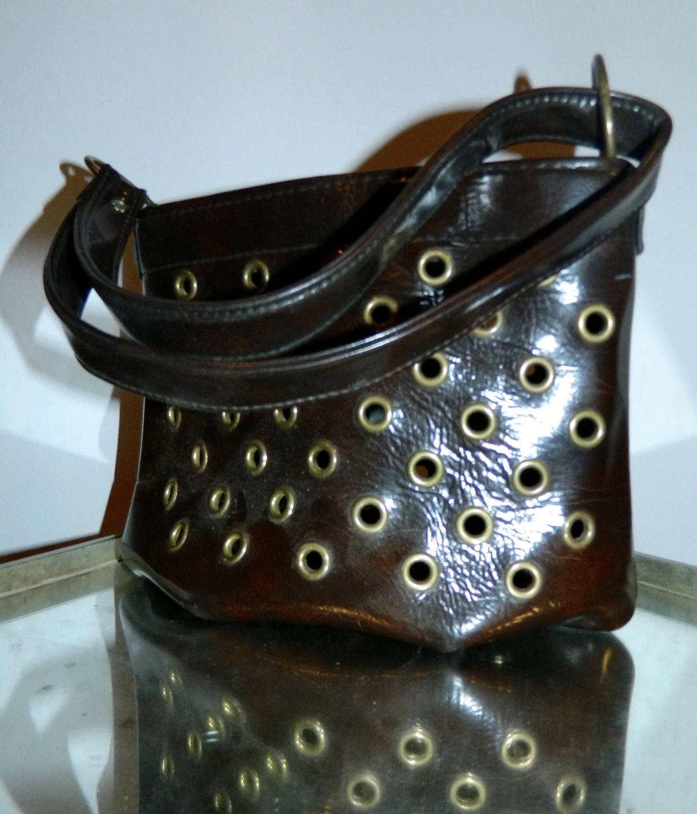 MOD handbag vintage 1960s brown vinyl grommeted purse / brass O rings